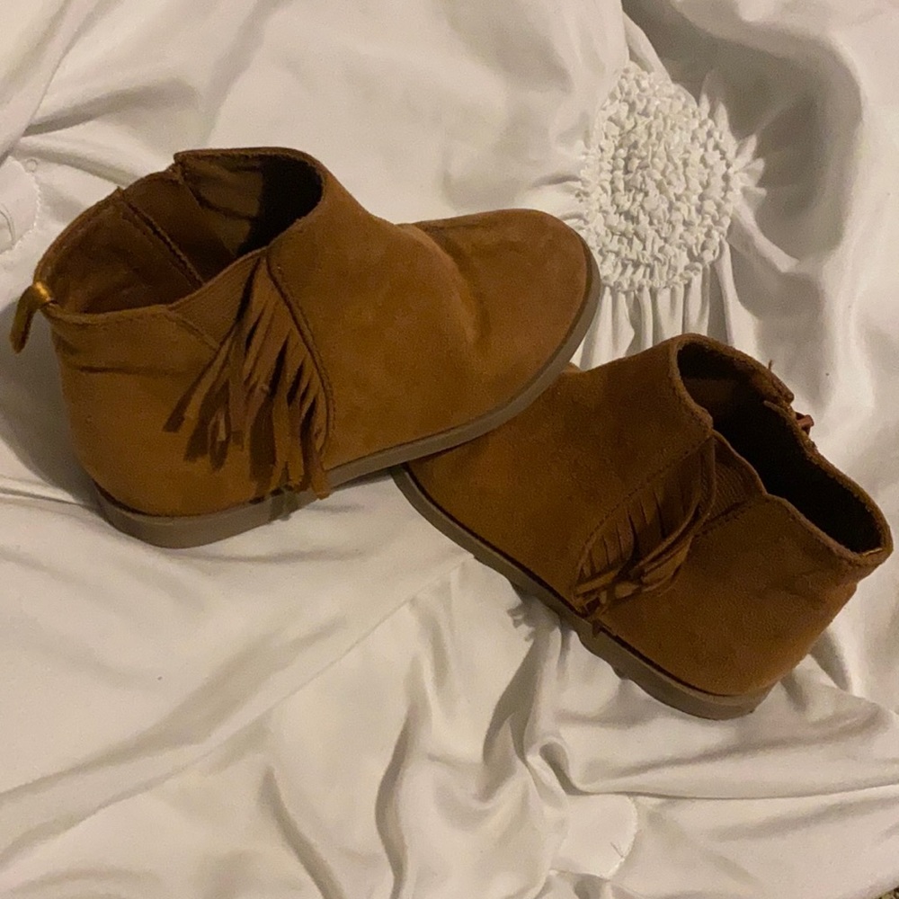 Cute old brown boots with fringe on the side